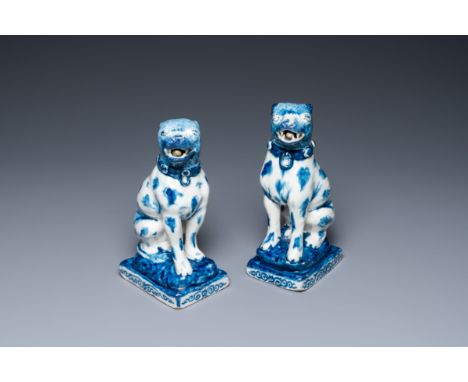 Full title: A pair of Dutch Delft blue and white seated dogs, 18th C.Description:H.: 20 cmÊ Provenance: - A Dutch private col