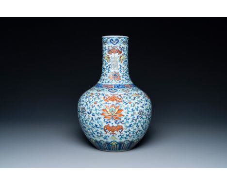 Full title: A Chinese doucai 'lotus scroll' bottle vase, Qianlong mark, 18/19th C.Description:H.: 36 cmÊ Condition: (UV-check