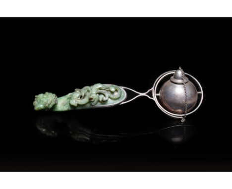 Full title: A Chinese jade belt buckle mounted as a table lighter in silver by Gump &amp; Co, Qing and 20th C.Description:L.: