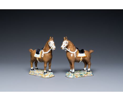 Full title: A pair of polychrome Dutch Delft horses, 18th C.Description:L.: 15,5 cm - H.: 15,5 cmÊ Each marked with a red axe