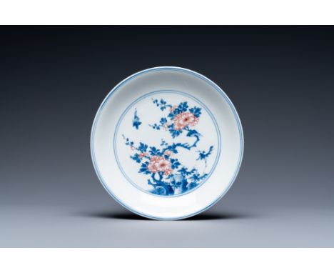 Full title: A Chinese blue, white and copper-red saucer dish with floral design, KangxiDescription:Dia.: 16 cmÊ Condition: (U