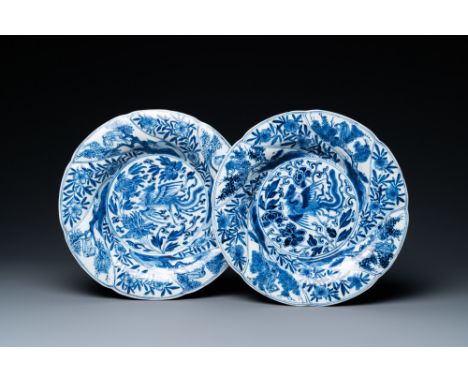 Full title: A pair of Chinese blue and white lobed 'phoenix and monkey' plates, KangxiDescription:Dia.: 21,5 cmThe absence of