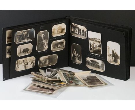 A complete vintage photograph album to include military interest together with a quantity of postcards. 