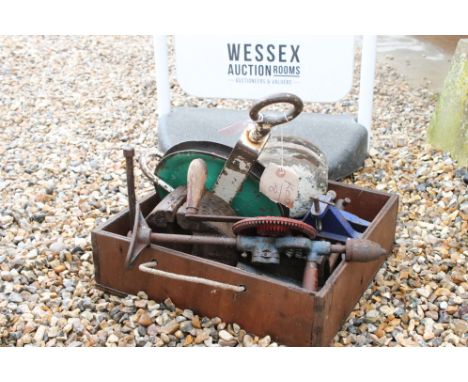 Collection of Vintage Tools to include three bench vices, iron and wood pulley, etc 