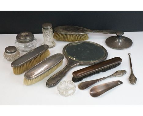 A collection of mainly hallmarked sterling silver items to include hand mirrors, brushes, button hooks....etc.