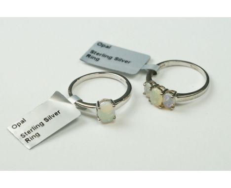 Two sterling silver ladies dress rings set with Opal cabochons. 