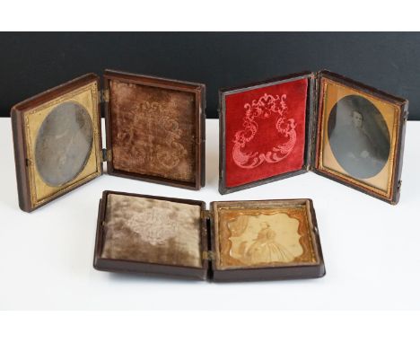 A collection of three 19th century Daguerreotype portrait photographs within original folding cases. 