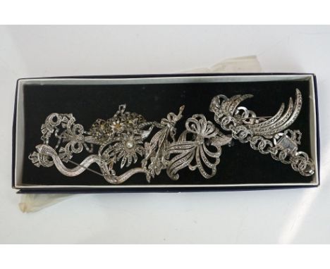 A small collection of vintage white metal and marcasite jewellery to include watches and brooches, some marked silver. 