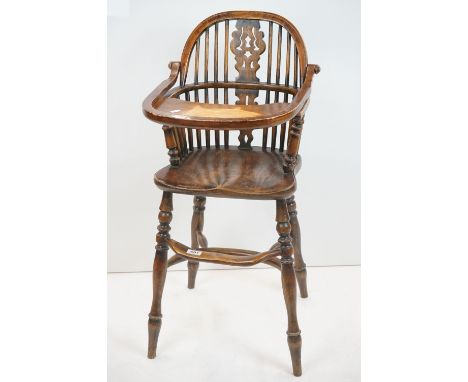 Elm and Ash Stick and Hoop Back Child's High Chair raised on turned legs with a foot rest and crinoline stretcher, later atta