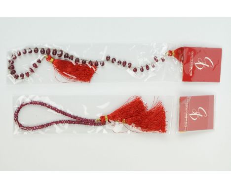 Two ruby faceted drop strands, approx 18cm in length. 