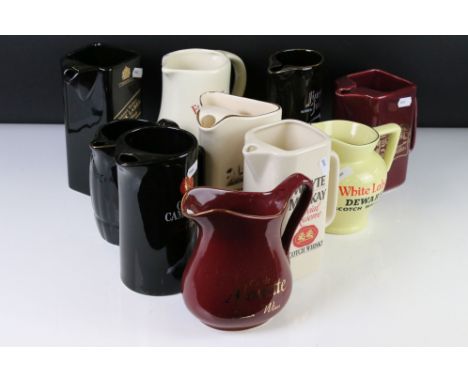 Nine Ceramic Wade and other Advertising Pub Whisky Water Jugs including Johnnie Walker Black Label, Tomatin, Clan Campbell, G