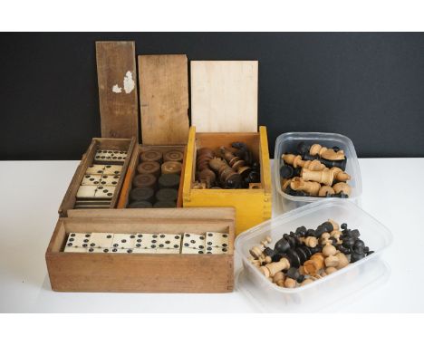 A collection of vintage games to include wooden chess sets, wooden draughts sets and bone dominoes sets. 