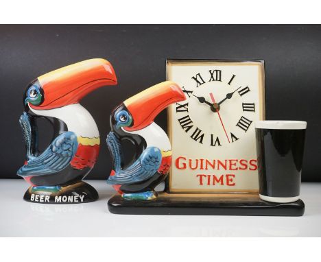 Guinness Ceramic Toucan Clock ' Guinness Time ', 21 cm high together with a Guinness Toucan 'Beer Money ' Moneybox, 22cm high