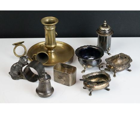 A small collection of mixed metalware to include hallmarked silver napkin ring, silver plated cruet set and brass chamber sti