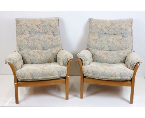 Pair of Ercol Light Elm Armchairs with padded cushions, 83cm wide x 96cm high 