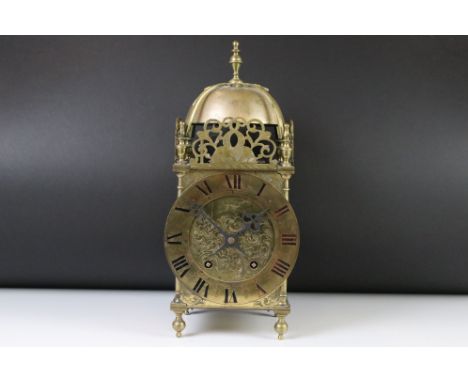 An antique Brass Striking Lantern Clock, four posted frame, pierced frets, movement backplate stamped W&amp;H Sch. 