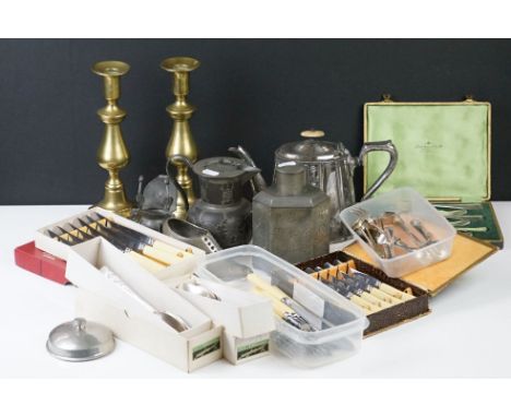 A collection of mixed metalware to include brass candlesticks, silver plated teapot, pewter tea caddy, cutlery....etc.. 