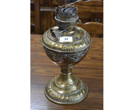 A Victorian brass oil lamp with Duplex burner (no chimney or shade)