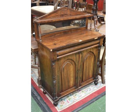 A William IV rosewood chiffonier architectural pediment, shelf support by turned columns, mirrored back to superstructure, lo