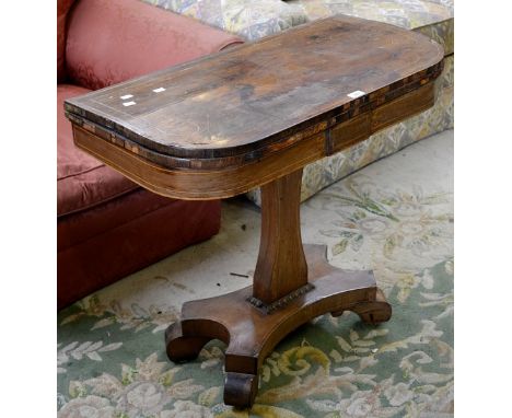 A William IV rosewood card table, rounded square inlaid top, baize playing area, incurved column, quatrefoil base, metal cast