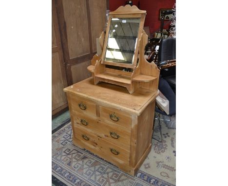 A Victorian pine dressing chest, mirror and shelf to superstructure, two short drawers over two long, plinth base