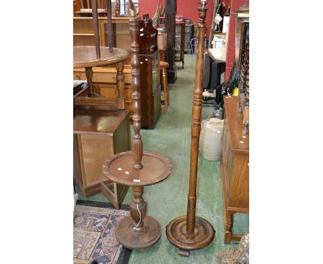 A 1940's oak standard lamp; another mahogany with smoker's stand. (2)