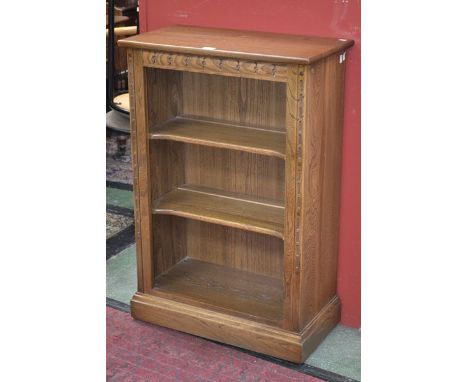 An Ercol elm bookcase, two tiers of shelving, 64cm wide, 97cm tall, 33.5cm deep