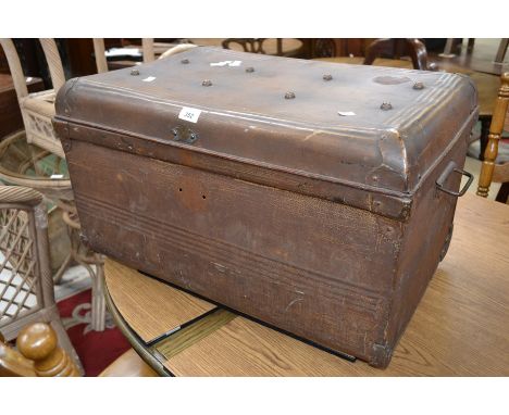 A large metal travel trunk