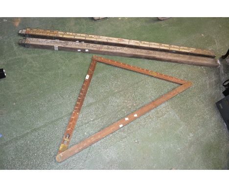 A vintage mahogany surveying triangle with spirit level, plumb bob and brass fittings, by PB & S Ltd bearing broad arrow mark