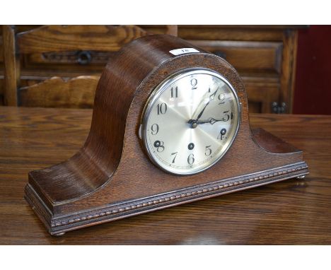 A 20th century oak mantel clock