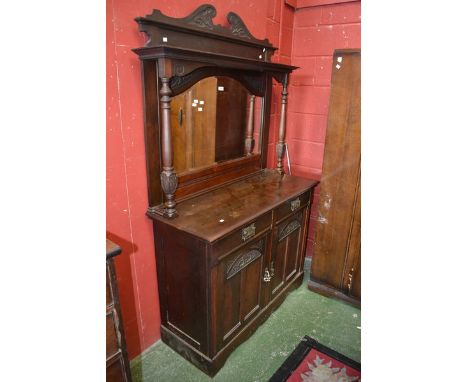 An Art Nouveau mahogany mirror back sideboard, carved swan neck pediment, bevel edge cresting arch mirror flanked by turned a