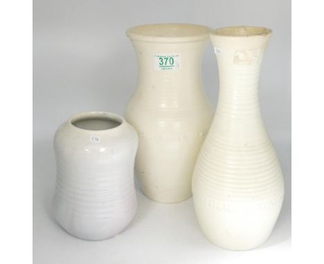 A collection of Moorcroft Studio Design ribbed vases: item with slimmest neck having hairline crack noted, height of tallest 