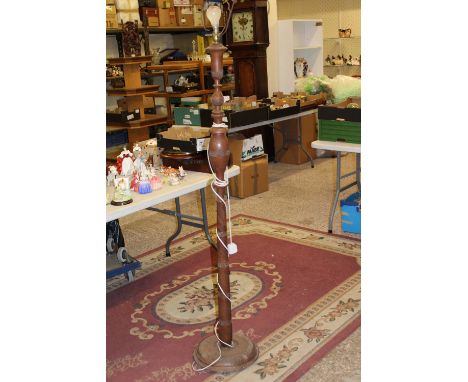 An early 20th century turned and carved mahogany standard lamp base: 
