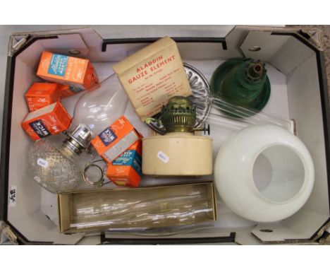 A collection of vintage oil lamps, spare wicks, chimneys etc (1 tray). 