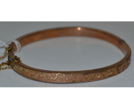 A 9ct gold hinged bangle, 7.7g