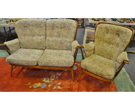 An Ercol Evergreen cottage suite, comprising a two seat sofa and armchair