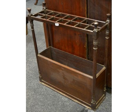 An early 20th Century mahogany walking stick stand, fourteen sections, metal liner