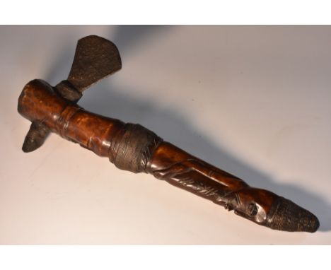 Tribal Art - an African axe, probably Yoruba, the bone shaft carved as a stylised figure, fan-shaped blade, 33cm long overall