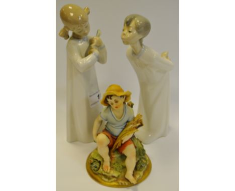 A Lladro figure of a girl playing a Mandolin; another Lladro figure; a Capodimonte figure of an Urchin (3)