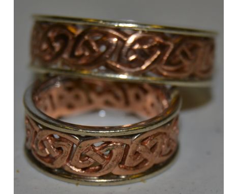 A pair of 9ct gold Celtic design rings, 13.2g gross
