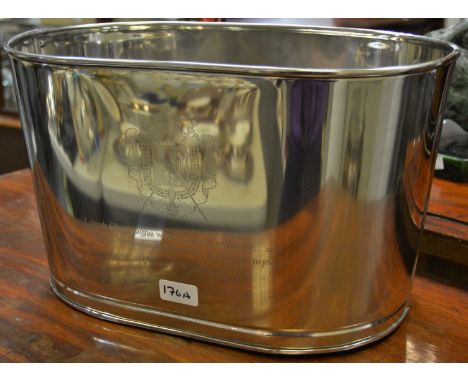 A modern chrome reproduction champagne trough, inscribed with Lily Bollinger quote 'I drink it when I'm happy and when I'm sa