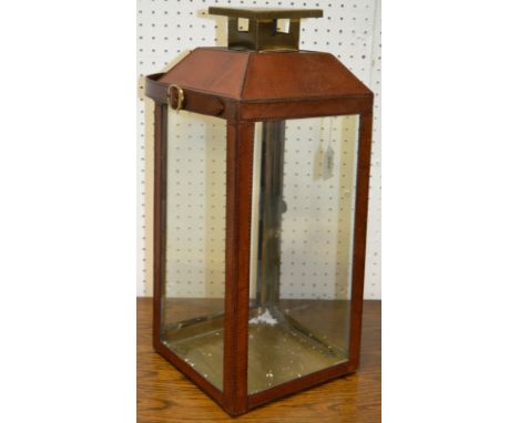 A contemporary leather cased lantern