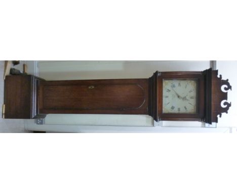 A late 18thC country made, oak longcase clock, the hood having a fretworked cornice, over a square, glazed door with flank pi