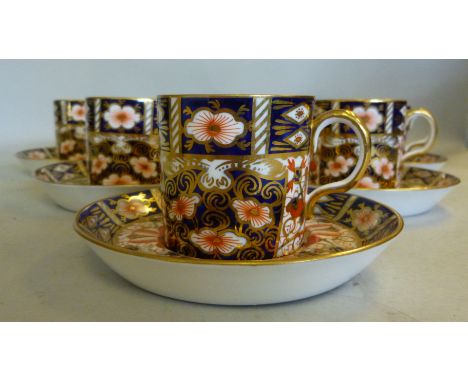 A set of six Royal Crown Derby china coffee cans and saucers, decorated in the Imari palette  bearing date cyphers for 1929