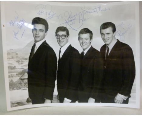 A monochrome photographic portrait of 'The Shadows' bearing the group member's signatures; and another of Cliff Richard, also