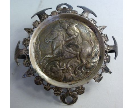 An Edwardian silver inkwell mount, the decoratively pressed and pierced collar with a circular aperture, enclosed by a hinged