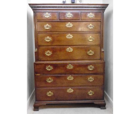 A late 18thC mahogany chest-on-chest, the upper part having an egg-and-dart and dentil carved cornice, over three, in-line, s