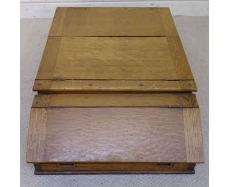 An early 20thC English made, light oak cased Celste Piano, the rising, angled flap revealing a keyboard and a label, inscribe