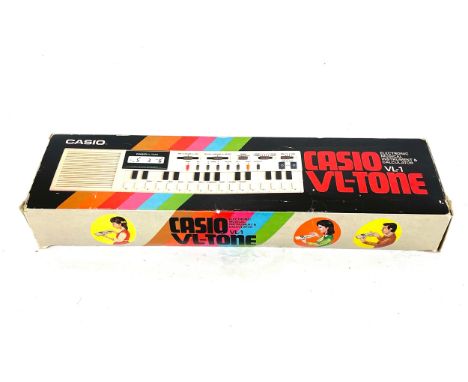 Vintage Casio VL-1 VL-TONE electronic musical instrument and calculator with original box and packaging 