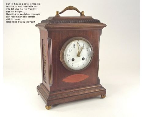 BRACKET CLOCK. An early 20th century inlaid mahogany bracket clock with white enamel dial. The French movement with the trade